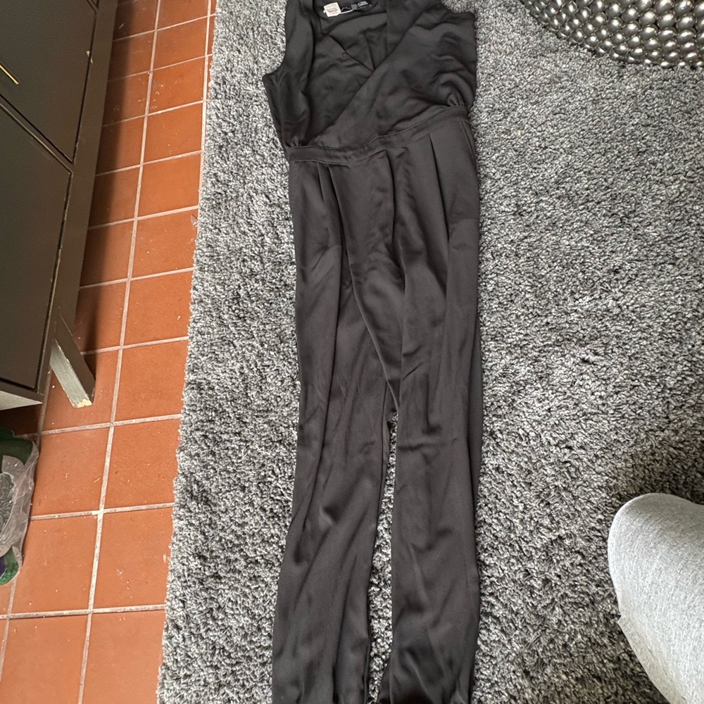 Sleek Black Jumpsuit with Modern Minimalist Design